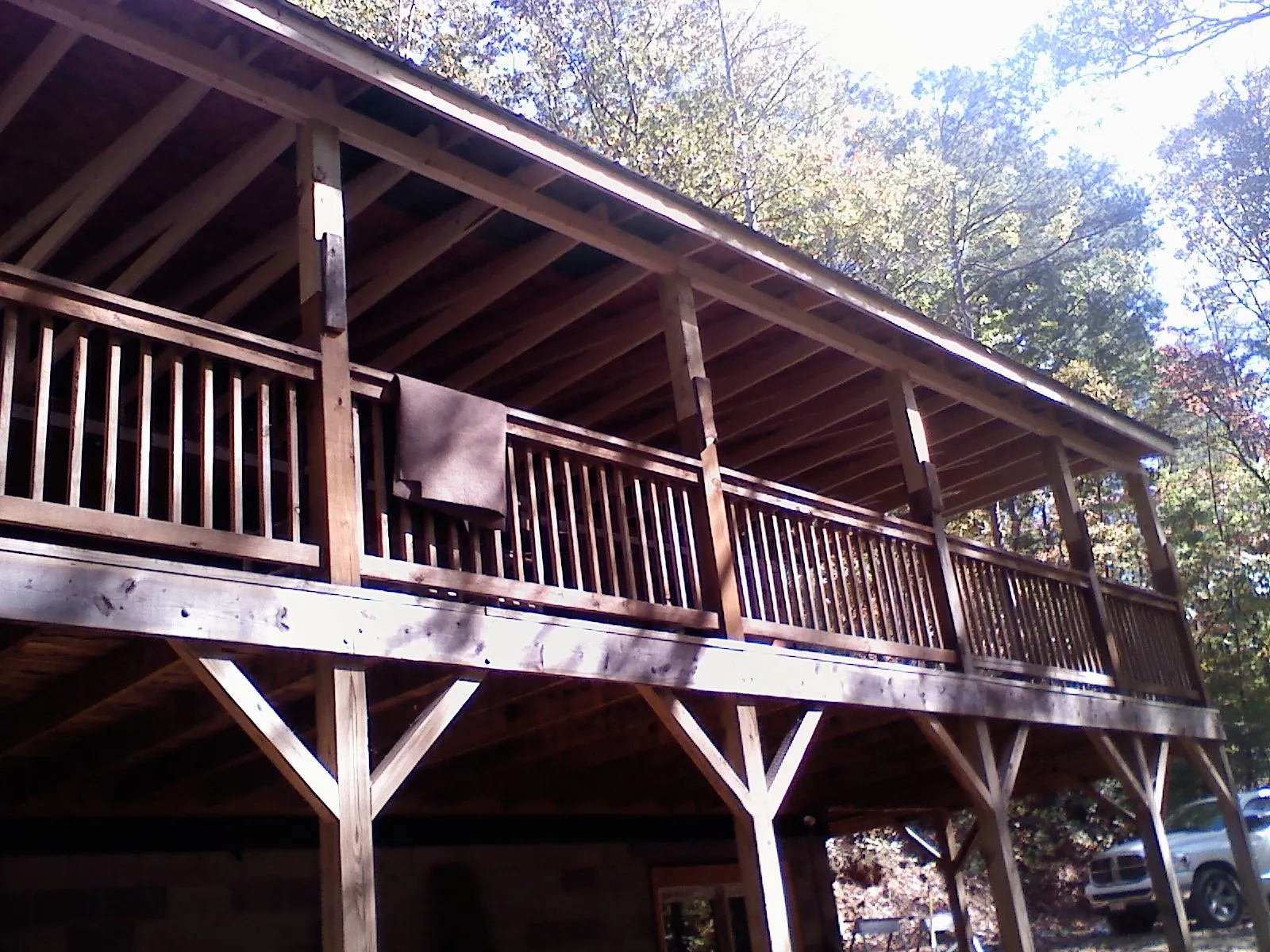Timber framing under a new elevated porch and deck — Roof Leak Repair in Buffalo Mills by Roofing Brothers